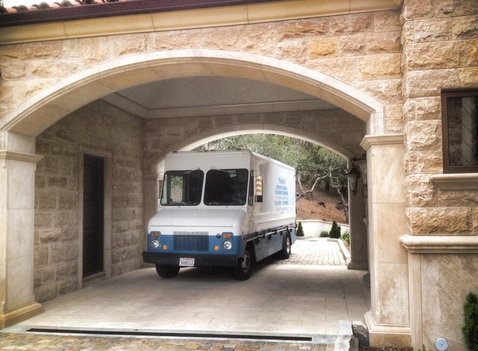 Mark's Sewer & Drain service van parked at a Monterey Peninsula property